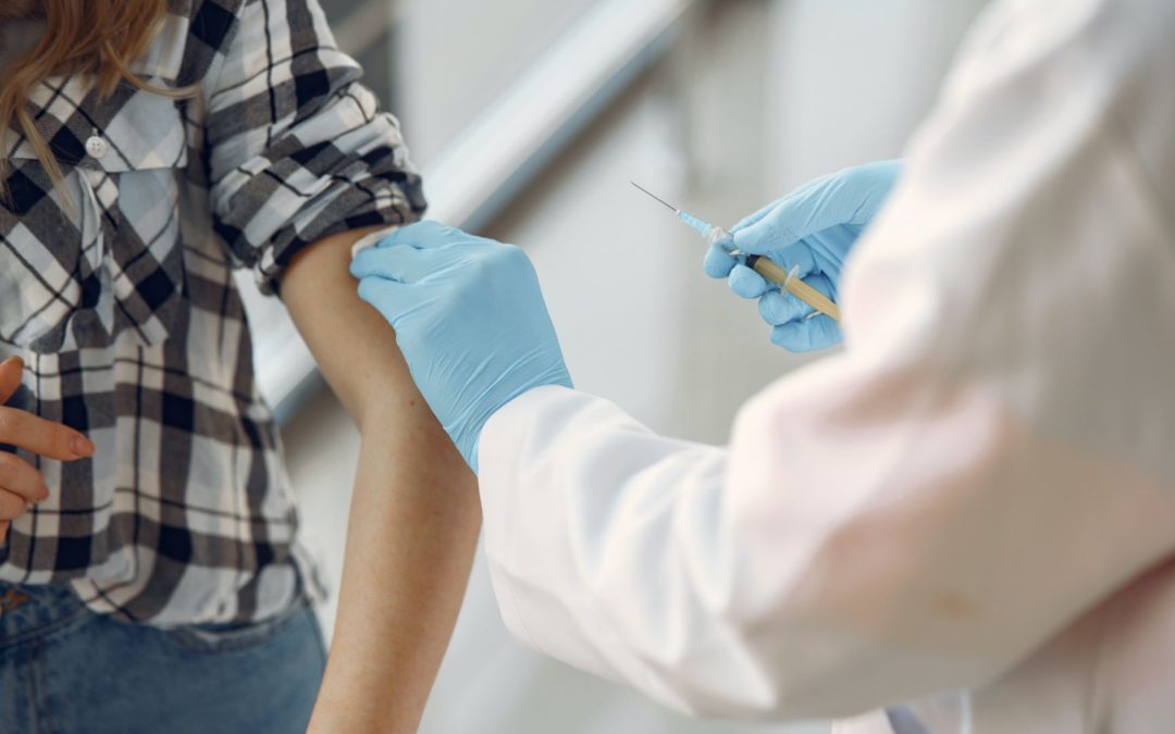 Provider preparing to give a person vaccine shot