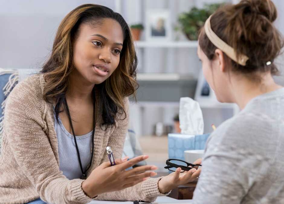 A counselor talks with a client.
